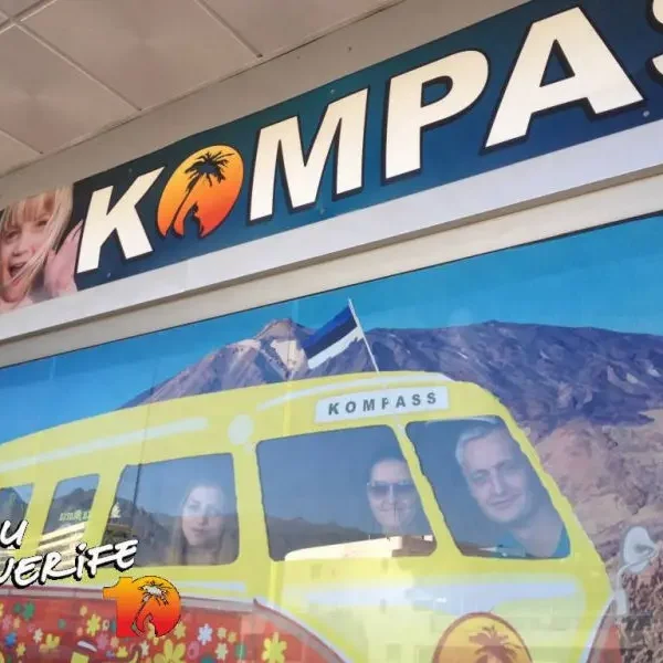 Kompass logo with Tenerife scenery and travel bus.
